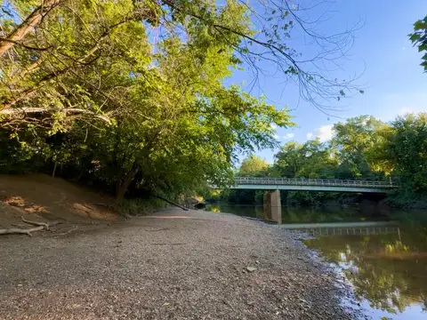 Riverside serenity under a summer sky.